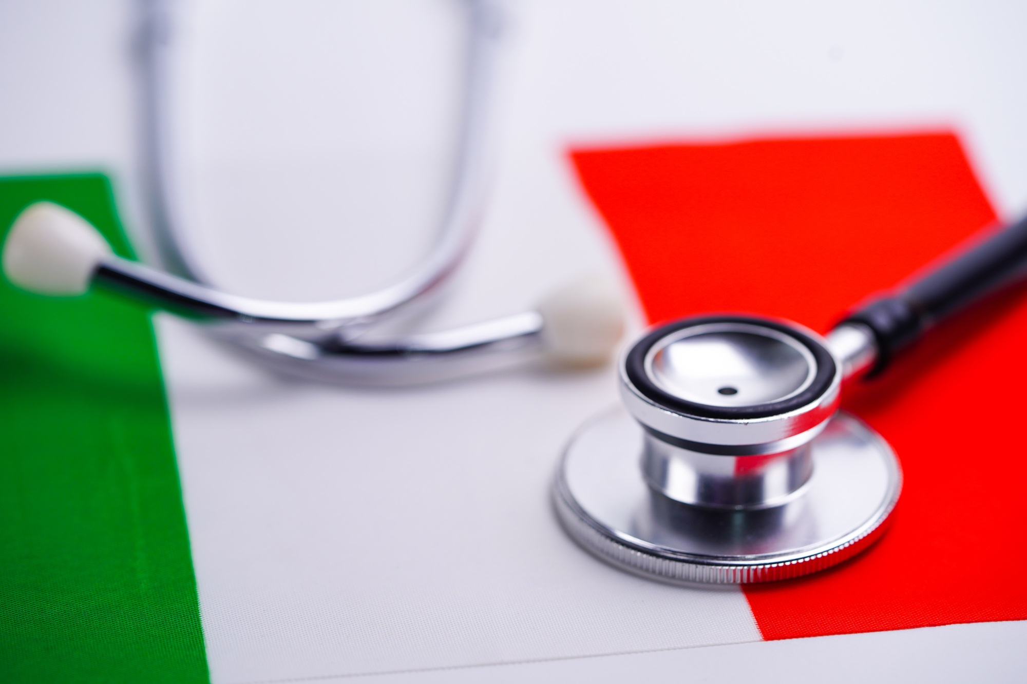Stethoscope with Italy flag background.