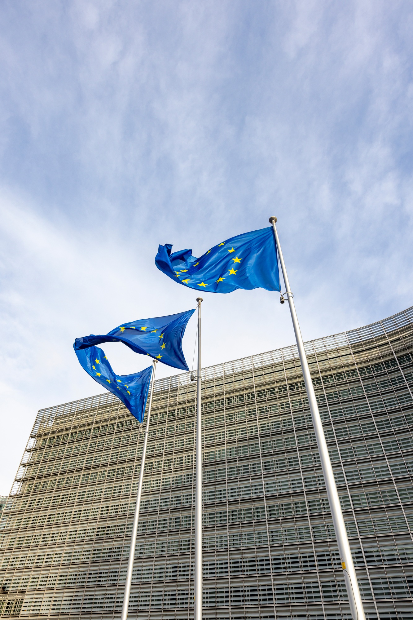 Flags of the European Union in front of the European Commission building in Brussels, Belgium